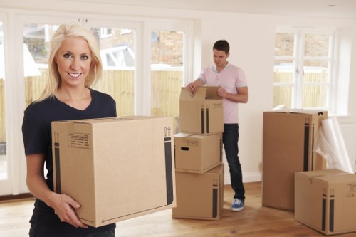 Moving team handling furniture during a van removal service