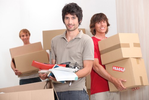 Movers carrying items through a South Kensington apartment building