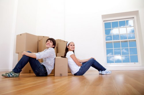 Packed boxes and protected furniture ready for a local home removal