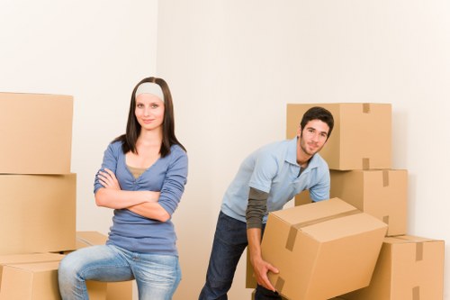 Removalists loading boxes and furniture for a South Kensington move