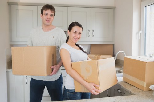 Local movers handling boxes in a South Kensington building with access challenges